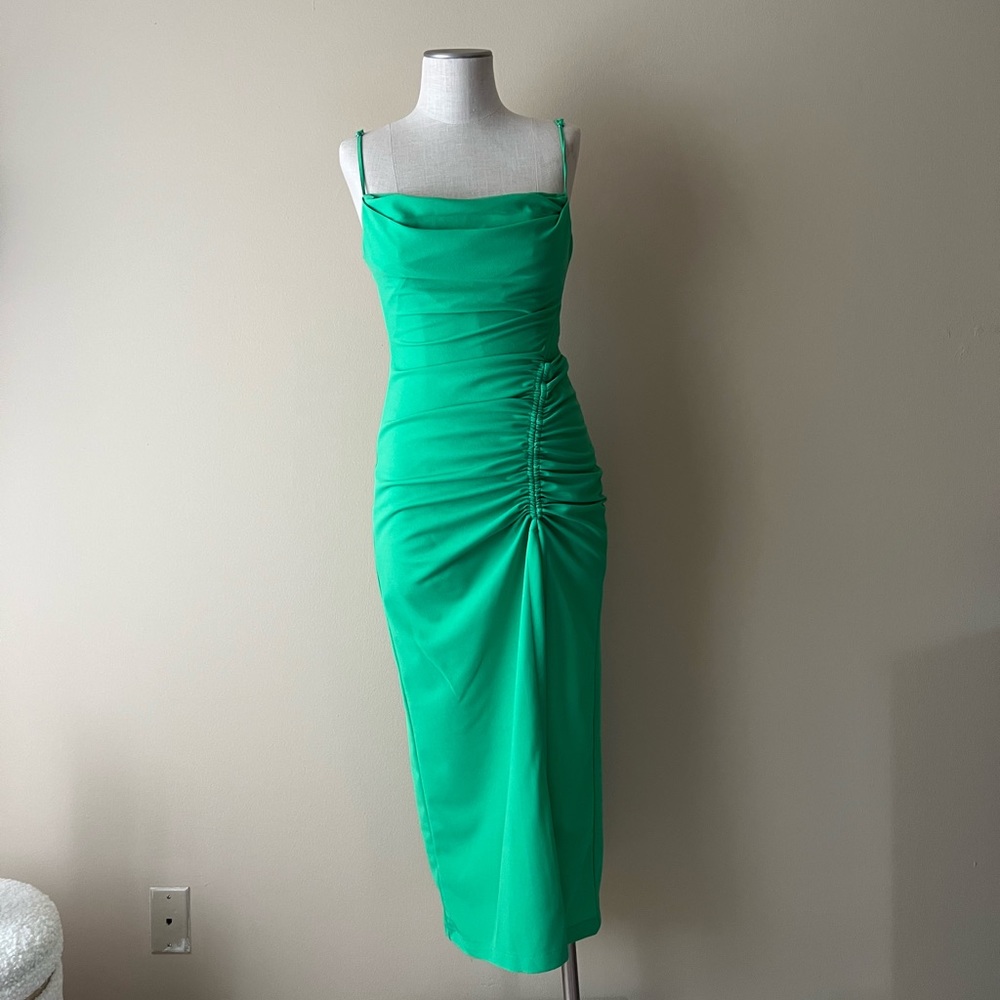 Green dress with spaghetti straps with a slit